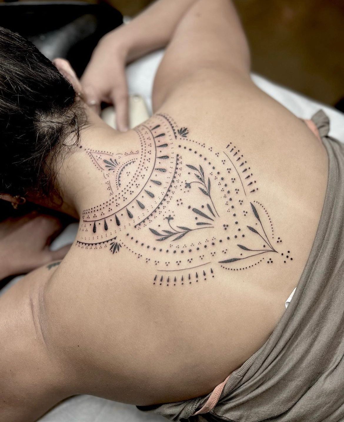 Fine line ornamental tattoo