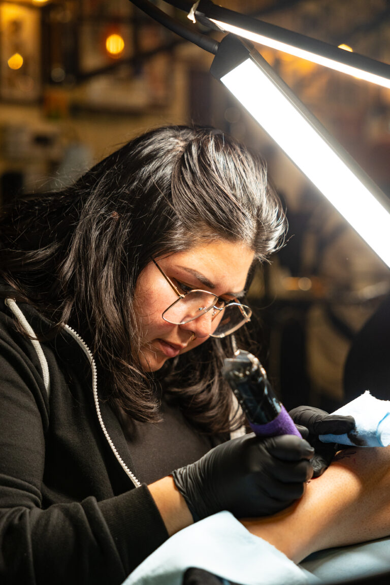 Artist at work on fine line piece